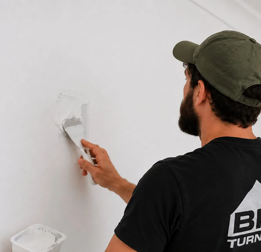 Wall repair in progress: Patching a damaged wall before finishing.